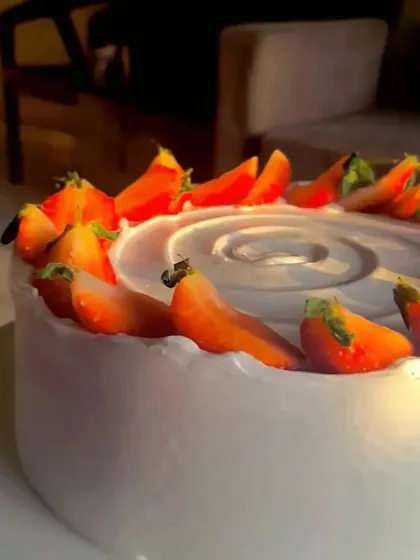 A close-up of the fresh strawberries on my classic strawberry cake, captured in the beautiful golden hour light.