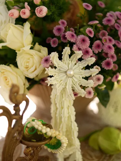 A handcrafted 'gajra' flower, a beautiful traditional element incorporated into the modern decor.