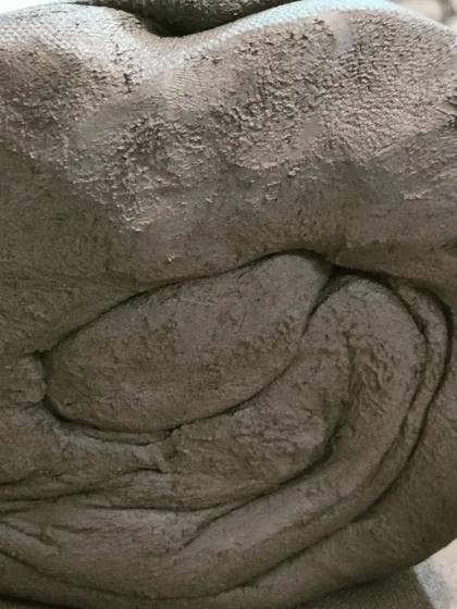 This view shows the dense, smooth consistency of the clay after it has been properly wedged. It's now ready to be transformed on the potter's wheel.