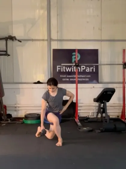A curtsy lunge with a dumbbell. This exercise targets the glutes and inner thighs from a different angle, adding variety to our leg work.