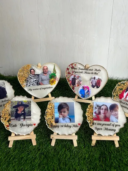 A collection of my custom resin photo frames, perfect for any occasion. From a baby's first birthday to a graduation gift, I can personalize each frame with photos, dates, and special messages to create a lasting keepsake.