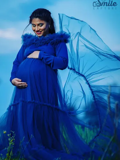 The royal blue color of this "Teel Tweety" gown is absolutely striking. The gown has a detachable ruffled net skirt, allowing you to create two different looks during your maternity session.
