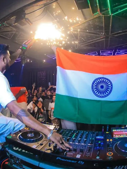Another angle of the Republic Day celebration, showing the Indian flag proudly displayed in front of the DJ booth. I love creating themed nights that resonate with the crowd.