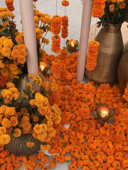 A close-up of marigold decor, showing the vibrant color and freshness of the flowers used.