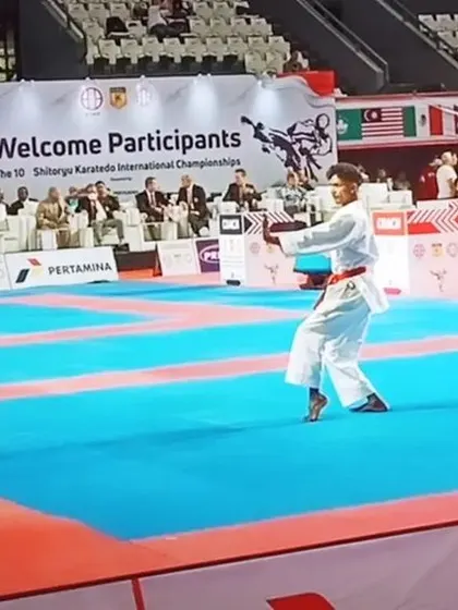 A focused moment during my Kata performance at the international championships in Jakarta. Competing at this level requires complete concentration and precision.