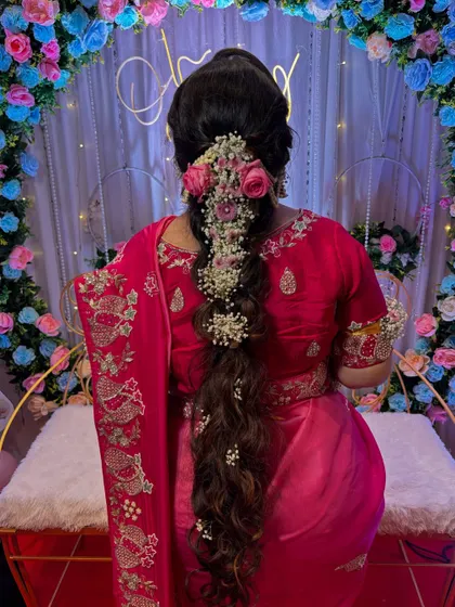 The full view of this stunning "Rapunzel" braid against the beautiful event decor. It was a perfect hairstyle for a special day.