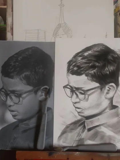 A side-by-side of the reference photo and my charcoal sketch, showing the process of creating realistic art.