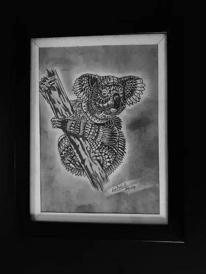 A cute koala clinging to a branch, its fur represented by a variety of detailed zentangle designs.