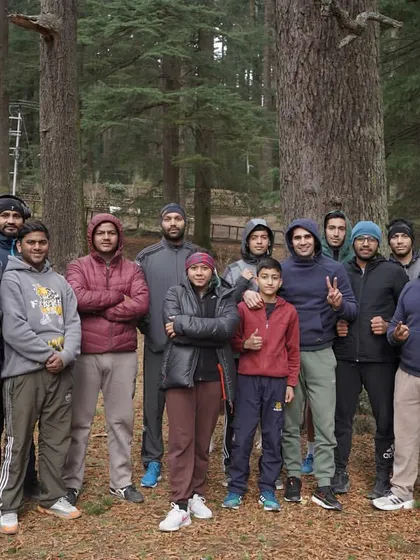 The full group after a refreshing yoga session in the woods. This is how we stretch, recover, and prepare our bodies for the next day's work.