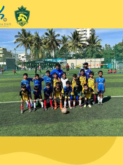 The U-9 team poses with their coaches before their YPL match against Raman SA.