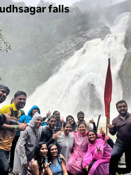 Another happy group at Dudhsagar falls, posing with our flag. The energy here is always incredible, especially during the peak monsoon season.