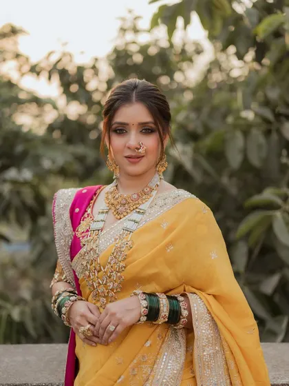 A beautiful portrait where the kohl-rimmed eyes speak volumes. The makeup is a perfect blend of tradition and modernity, creating a look that is both powerful and graceful.
