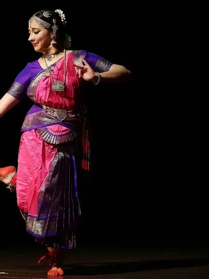 A moment of pure grace captured on stage. Perfecting the lines, posture, and movement of each adavu is a key part of our intensive training, ensuring every student performs with confidence and technical skill.