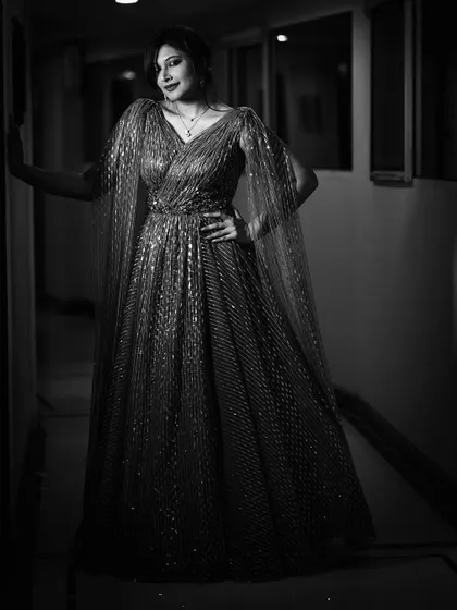 A classic black and white portrait of Shweta Vijay Nair. I styled her in a shimmering gown with cape sleeves, creating a timeless and elegant silhouette perfect for a formal evening event.