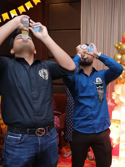 Fun games for a carnival party! Guests had a blast with the "drink up" baby bottle game, adding a playful and competitive element to the celebration.
