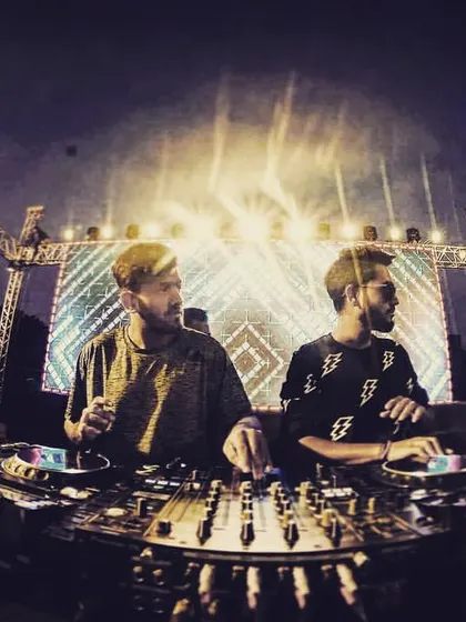 A candid shot of us working together on the Pioneer DJ console. Our B2B sets are all about synergy and reading each other's energy.