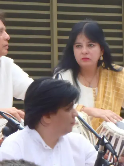 A photo of me performing alongside my Guru, Ustad Zakir Hussain. These annual 'Barsi' concerts in homage to his father, Abbaji, were incredible gatherings of music, learning, and love.