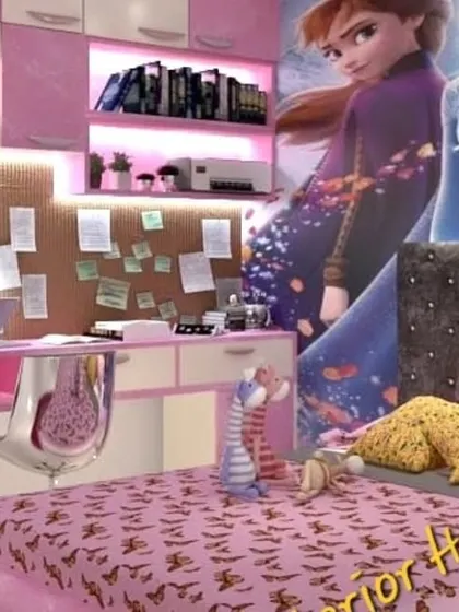 A close-up of the study area in the 'Frozen' themed room, with a pinboard for notes and art, and plenty of storage.