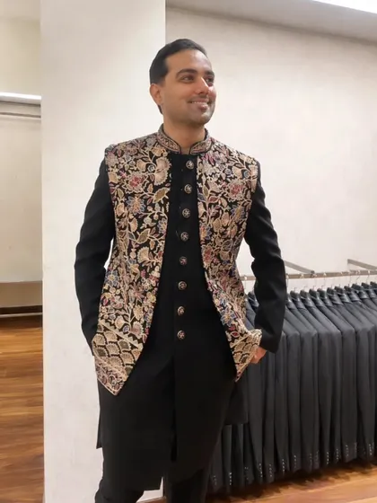 Floral embroidery covers the Bandhgala I'm modelling for Prestige The Man Store, with a black ethnic-wear ensemble.