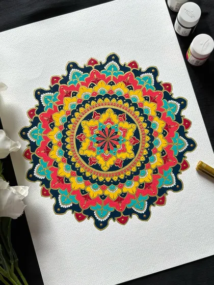 The beauty of ornate mandalas lies in their rich colors and bold patterns. This piece, painted with acrylics, shows how we can combine traditional motifs with a vibrant palette to create something truly stunning.