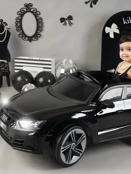 For this little girl's first birthday, we went for a chic and stylish theme. Seeing her behind the wheel of this mini Audi, looking like a little star, was just the cutest thing.