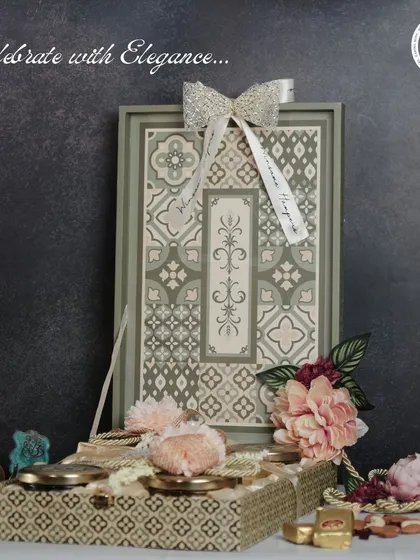 Celebrate with elegance using this sophisticated gift set. It features a beautifully patterned tray and a matching box filled with gourmet sweets and nuts, perfect for a refined Diwali present.
