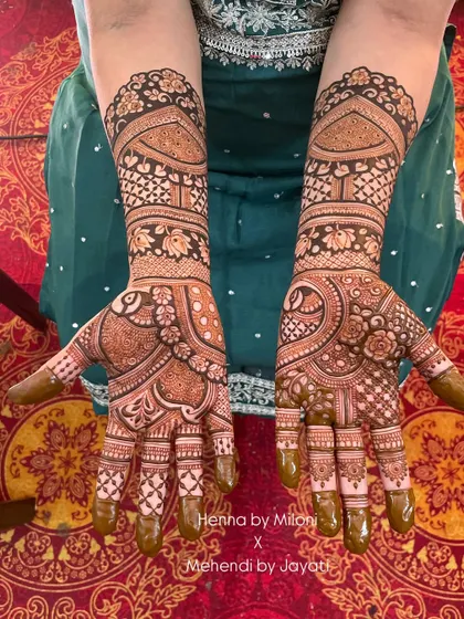 Another matching set for the groom's family, this one with elegant peacock and floral motifs.