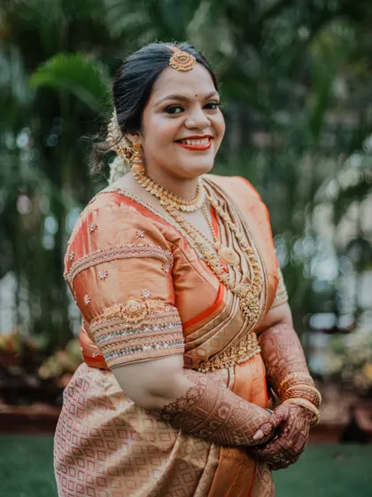 Another beautiful portrait of a South Indian bride. The makeup is flawless and traditional, designed to last through all the ceremonies while keeping her looking fresh and radiant.