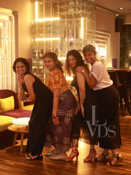 A group of women posing for a fun picture, showing the friendships and camaraderie built at our events.