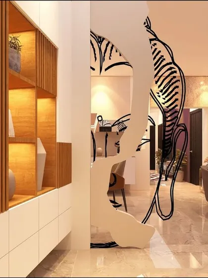 This foyer unit features an abstract metal partition, blending art with function to create a memorable entryway.