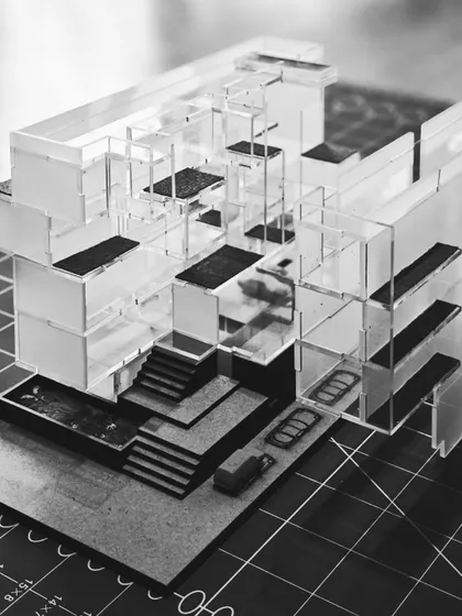 An intricate acrylic architectural model for a residential project. We build detailed physical models like this to understand and test the complex interplay of spaces, levels, and light, ensuring the final design feels right before the first brick is laid.