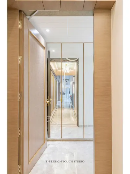 A view from the doorway, showing how mirrored wardrobes can transform a passageway, making it feel brighter and more open.