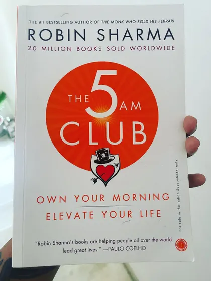 I'm not usually one for self-help books, but "The 5 AM Club" by Robin Sharma is different. It's a treasure trove of information on time management, consistency, and finding balance, which are all keystones of my coaching philosophy.