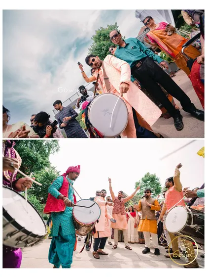 The dhol players leading the charge, with guests dancing enthusiastically behind them.