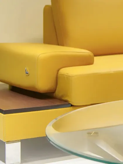 A detail shot of modern furniture, highlighting clean lines and a bold pop of color.
