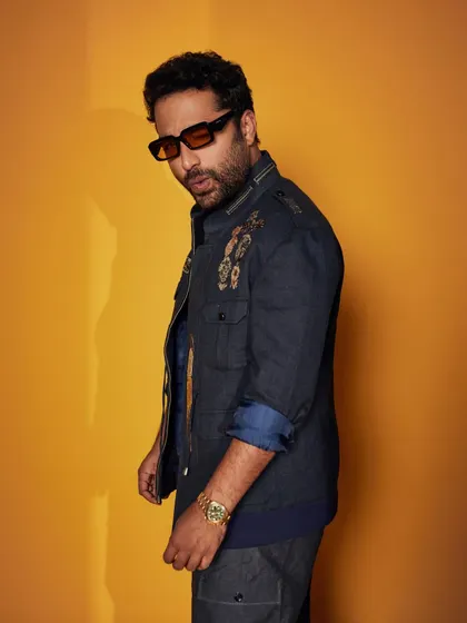 Vishwak Sen in a striped blue flannel wool jacket. This piece blends comfort and style, featuring a collared design with printed metal accents for a touch of industrial elegance.