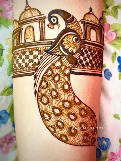 The completed peacock and palace arm band, showing the full detail of the feathers and the lattice work.