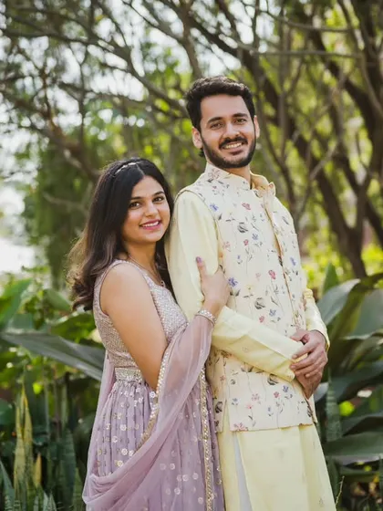 A classic couple portrait from Srushti and Akshay's engagement. They look so poised and happy against the beautiful green backdrop.