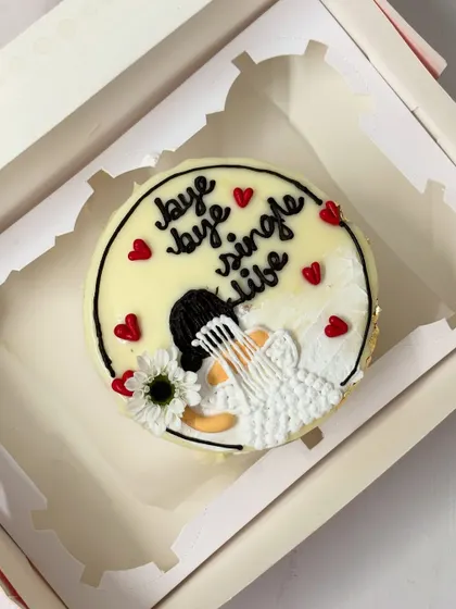 Celebrate the end of single life with this beautiful cake for a bride-to-be. It features an illustration of a bride in her veil with the message "bye bye single life."