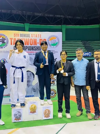 Athletes on the podium at the Bengal State Championship, representing different belt levels and age groups.
