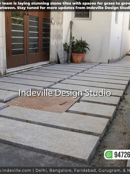 A duplicate image of the stone tile pathway under construction.