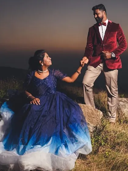 A dramatic sunset pre-wedding shoot on a hilltop. I provide couple costumes for rent, like this beautiful blue ombre gown and the matching red velvet blazer.