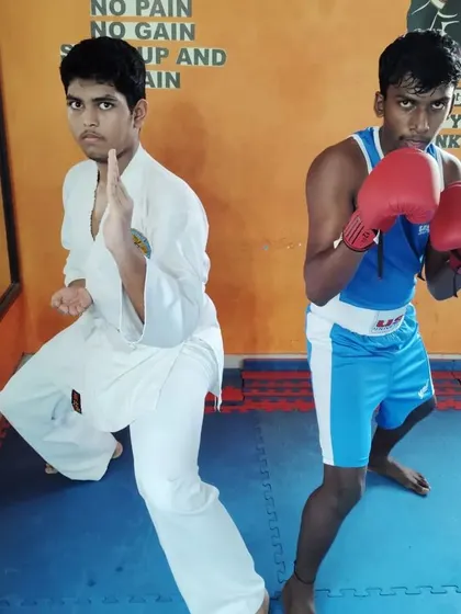 Two of my young students facing off, one representing Karate and the other Boxing. This highlights the mixed martial arts environment we foster, where different styles come together.