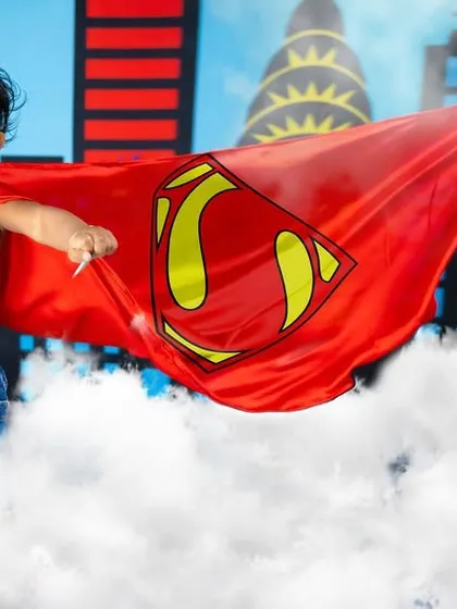 It's a bird, it's a plane, it's Super Baby. This dynamic shot captures our little hero flying through the clouds to save the day.
