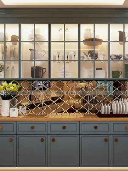 This stunning crockery unit features a charcoal grey duco finish and a decorative diagonal mirror backsplash. The clear glass shutters on the wall unit allow for an elegant display, while the base unit provides ample concealed storage.
