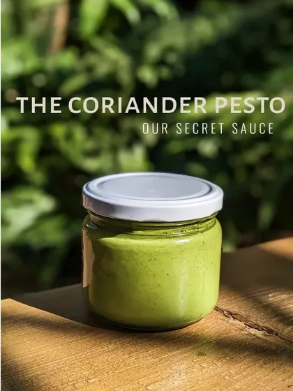 This is our secret sauce: the coriander pesto. Made fresh with roasted nuts, olive oil, and a kick of lime, it’s the flavourful first layer on our popular tartine toast. You can also buy a jar to take home.