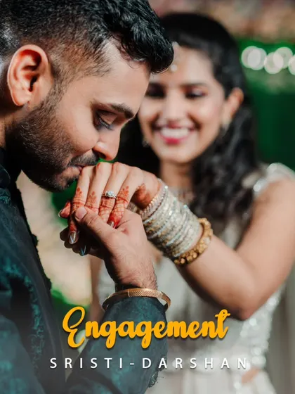 A duplicate of image 318, a romantic and iconic shot of the groom kissing the bride's hand.