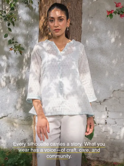 Every silhouette carries a story. This Suhani flared top, with its tie-dye effect and delicate appliqué, has a voice of craft, care, and community, made to be worn and loved for years.