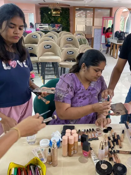 Getting familiar with a professional makeup kit is a core part of the training. Students learn to identify and swatch different products, from foundations to concealers.