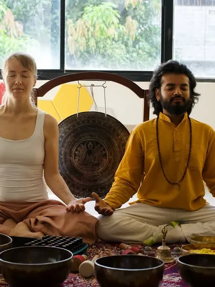 Leading a meditation session with a fellow aromatherapy expert.